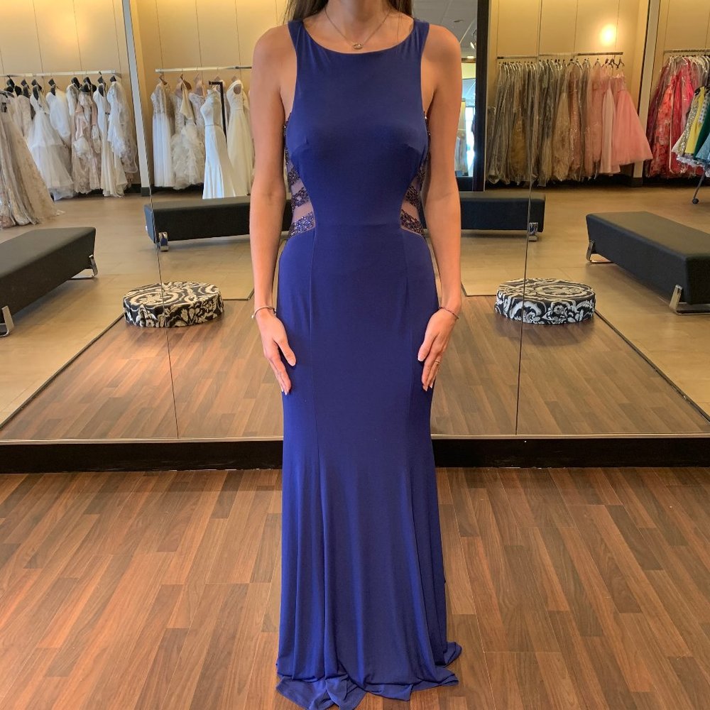 jersey gown with sheer sides and back panels.